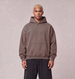 Essential Oversized Hoodie in Brown, front view on model